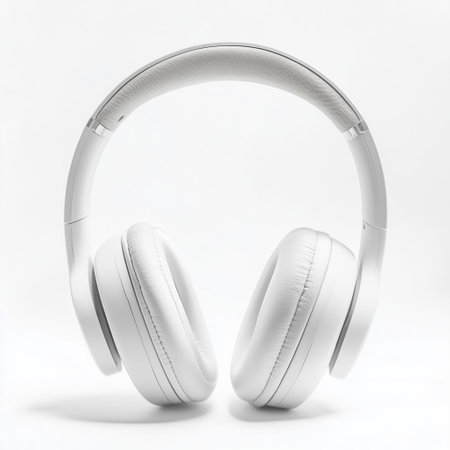 White wireless headphones positioned against a plain background showcasing modern design and sound technologyの素材