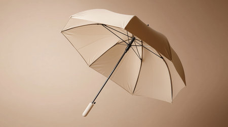 Open umbrella against a neutral background highlighting design and textureの素材