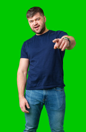 posing in front of a bright green backdropの写真素材