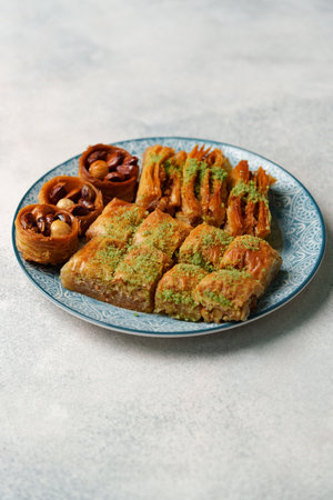 Delicious assortment of traditional pastries on decorative plate showcasing rich flavors and...