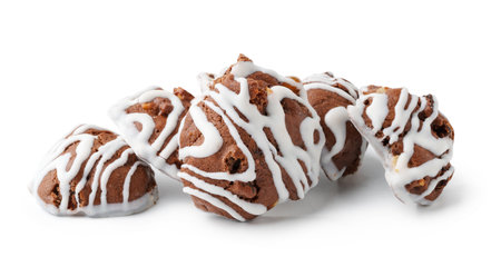 Delicious chocolate cookies with white icing arranged on a clean background for a tempting dessert displayの写真素材