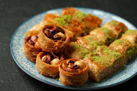 Delicious assortment of traditional pastry desserts on a decorative plate at a festive gathering