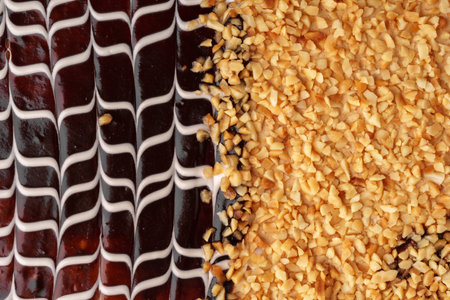 Chocolate dessert topped with crushed nuts showcases intricate design and delightful textures