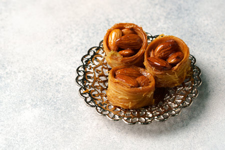 Delightful dessert of almond pastries served on a decorative plate in an elegant settingの写真素材