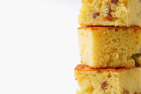 Delightful slices of moist yellow cake stacked on each other in a bright setting
