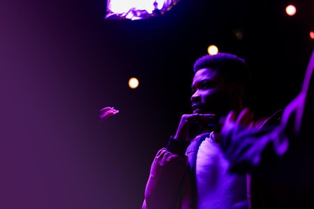 Youthful expressions during late-night music performance at local venue filled with vibrant lights