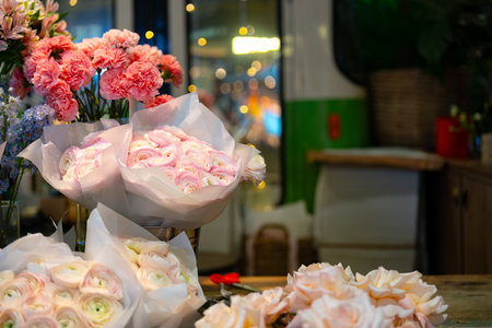 Beautiful display of fresh flowers in a cozy shop on a spring afternoon with soft lighting and colorful petalsの写真素材