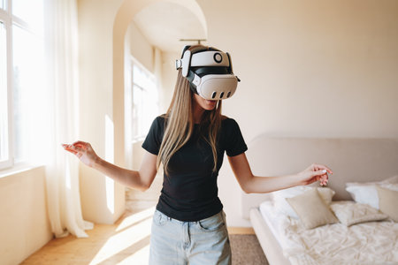 Engaging in virtual reality gaming indoors while wearing a VR headset in a modern living space