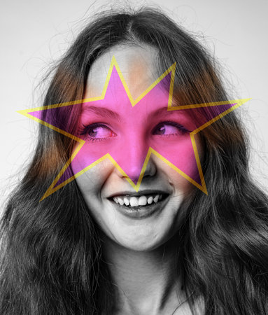 Creative portrait of a young woman with abstract star overlay in a studio setting during the dayの写真素材