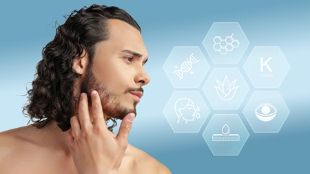 Man exploring skincare benefits while examining natural ingredients for healthy skin in a modern settingの写真素材
