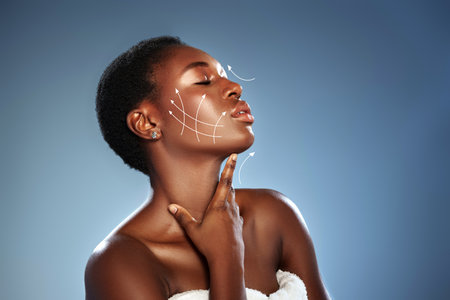 Skincare techniques demonstrated by model with radiant skin in beauty studioの写真素材