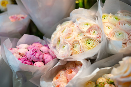 Beautiful arrangement of colorful flowers in bouquets at a local market in springの写真素材