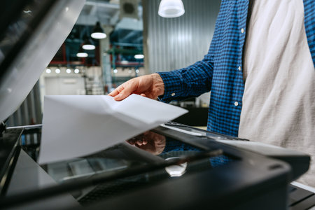 Copying documents in a modern office environment during the day