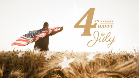 Celebrating independence day with a flag in the wheat field at sunsetの写真素材