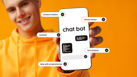 Young man showcasing a smartphone displaying a chatbot interface and features with a vibrant orange backgroundの写真素材