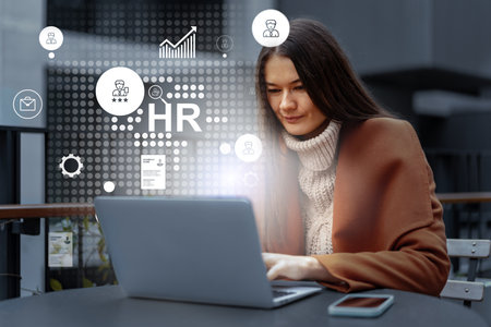 Professional woman engages in remote human resources project in urban workspace during morning hoursの写真素材