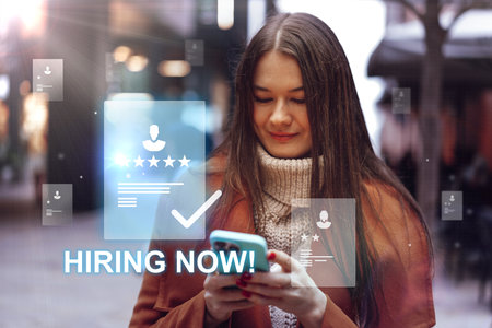 Young woman looking at phone while surrounded by hiring notifications in a busy urban environment