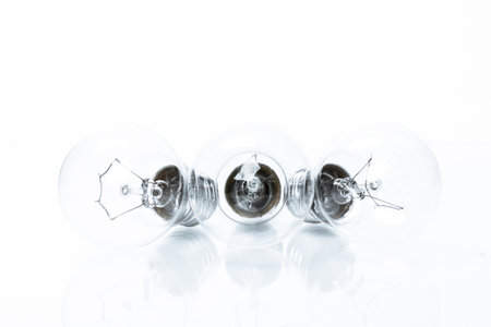 Many lightbulbs on white background close up