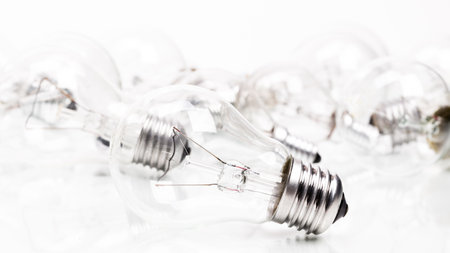 Many lightbulbs on white background close up