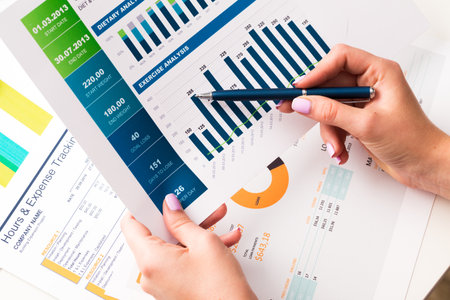 Accounting documents analysis. Charts and graphs close up