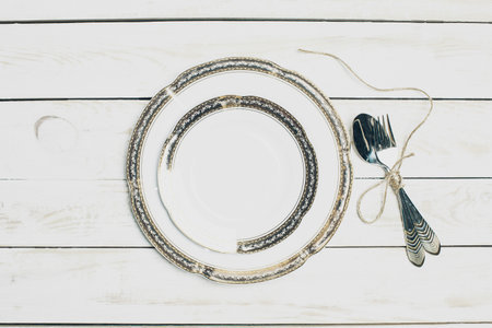 Set of white table ware with golden border