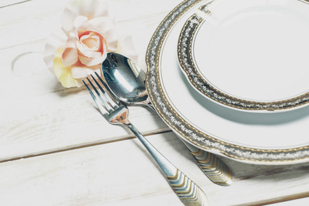 Set of white table ware with golden border