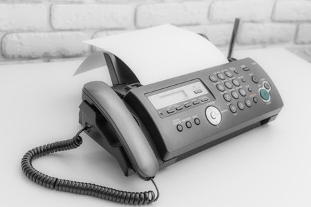 Fax machine, office equipment on white table