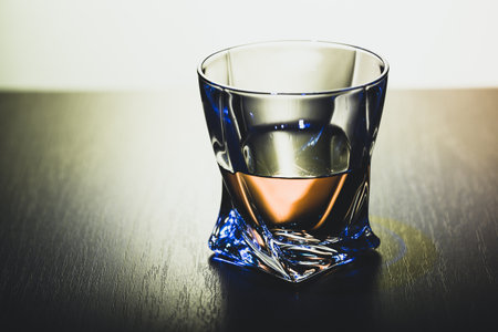 Strong alcoholic drink in glass close up