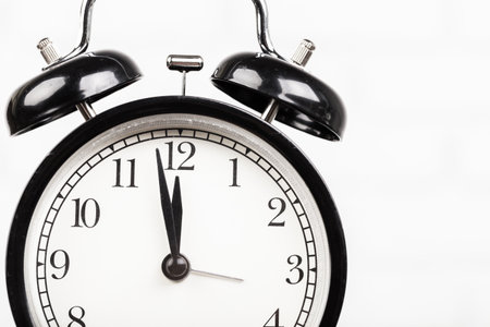 Close up of a black vintage alarm clock
