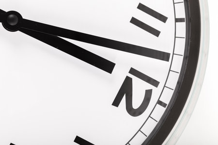 Close up of a wall clock. Time management concept