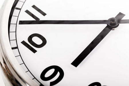 Close up of a wall clock. Time management concept