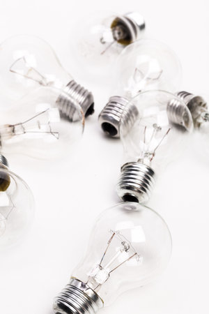 Many lightbulbs on white background close up