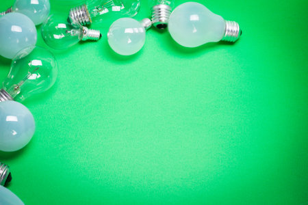 light bulb on green background close up