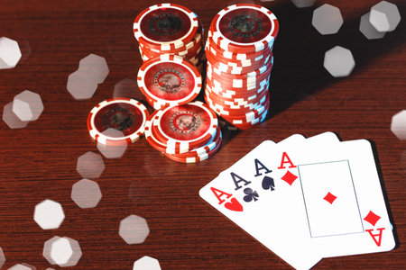 Poker cards and chips on blurred background