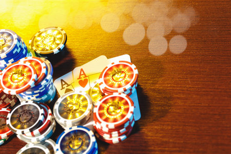 Poker chips stacks on bokeh light background