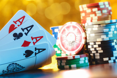 Poker cards and chips on blurred background