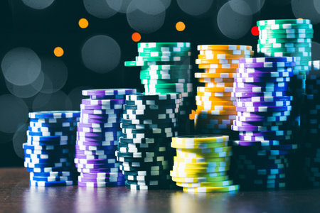 Poker chips stacks on bokeh light background
