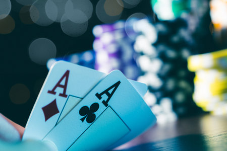 Poker cards and chips on blurred background