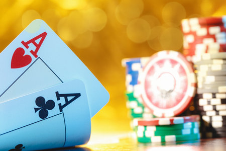 Poker cards and chips on blurred background