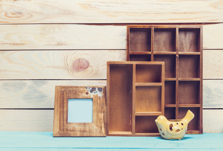 Cozy pastel wooden home decor objects on blue background