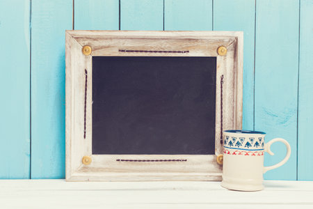 Cozy pastel wooden home decor objects on blue background