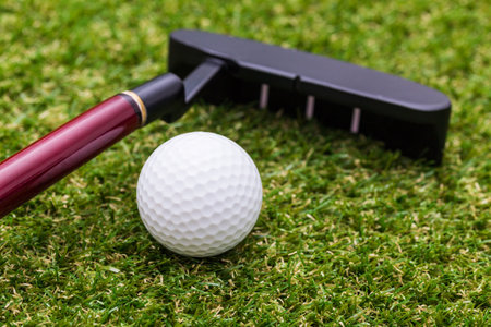 Mini golf equipment on grass close up