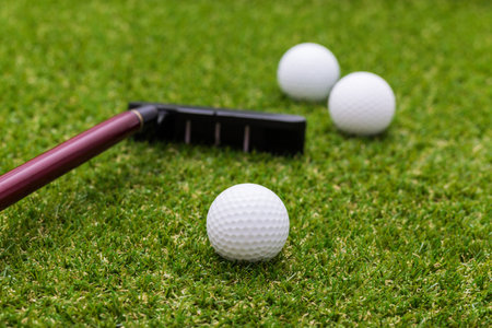 Mini golf equipment on grass close up