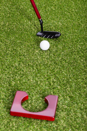 Mini golf equipment on grass close up