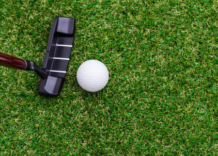 Indoor mini golf equipment set on green grass background
