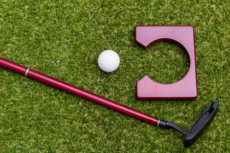 Mini golf equipment on grass close up