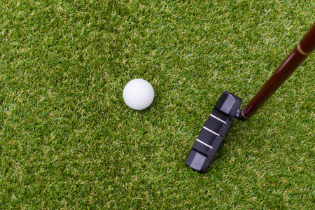 Mini golf equipment on grass close up