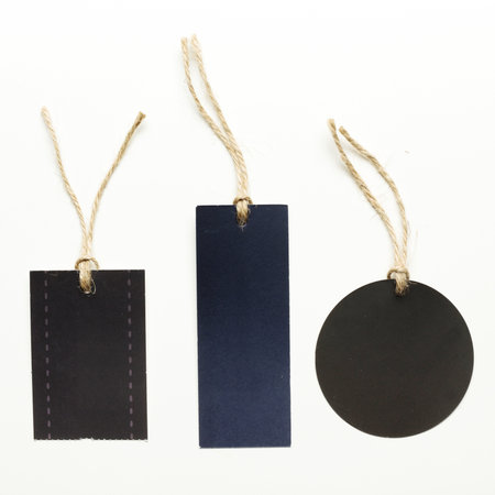 Different shapes and colors of tags on strings for various labeling purposes