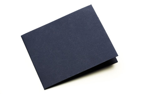 Simple navy blue cardstock folded into a neat booklet for various uses at eventsの写真素材