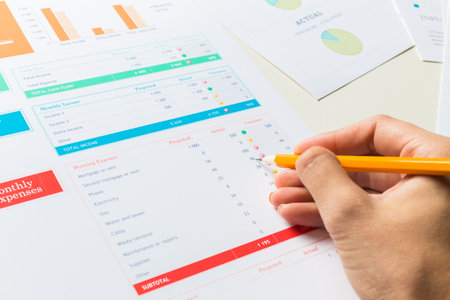 Analyzing monthly expenses and income in a financial report